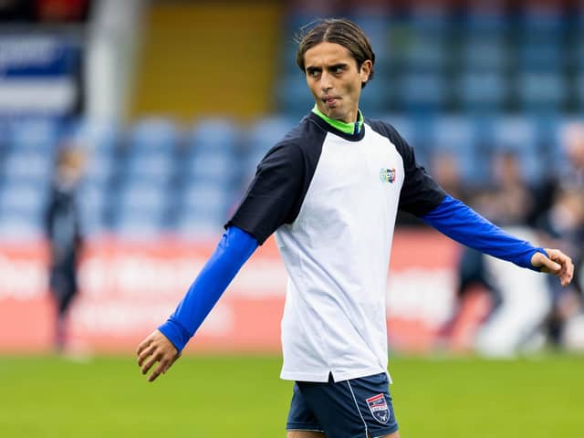 Ross County's Yan Dhanda warms up ahead of kick-off against Hibs on Saturday. (Photo by Ross Parker / SNS Group)
