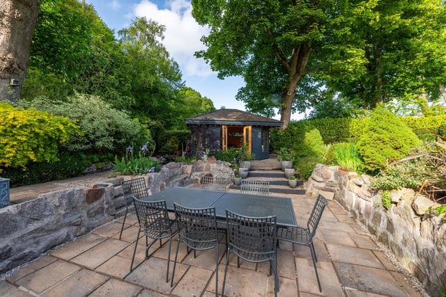 The expansive property occupies a secluded plot with landscaped gardens.