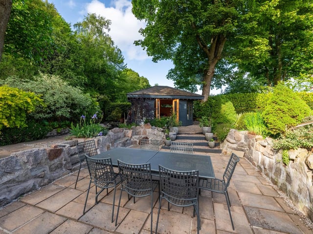 The expansive property occupies a secluded plot with landscaped gardens.