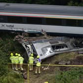 Members of the emergency services inspect the debris and derailed carriages at the scene of the train crash near Stonehaven in north-east Scotland on August 12, 2020. Picture: Ben Birchall/POOL/AFP via Getty Images