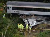 Members of the emergency services inspect the debris and derailed carriages at the scene of the train crash near Stonehaven in north-east Scotland on August 12, 2020. Picture: Ben Birchall/POOL/AFP via Getty Images