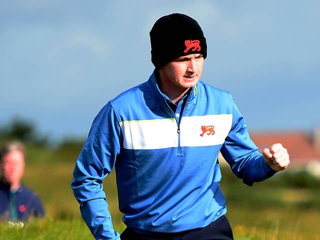 Sandy Scott of GB & Ireland celebrates holing a putt during day the 2019 Walker Cup at Royal Liverpool. Picture: Richard Martin-Roberts/R&A/R&A via Getty Images.