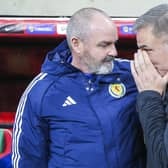 Scotland's head coach Steve Clarke, left, talks to Turkey' counterpart Stefan Kuntz prior the kick-off at the Diyarbakir Stadium. (AP Photo)