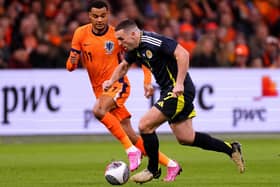 Scotland's John McGinn looks for a way past Netherlands' Cody Gakpo during an international friendly match at the Johan Cruyff Arena, Amsterdam.