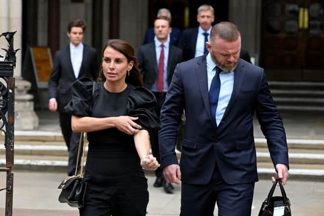 Coleen Rooney departs with husband Wayne Rooney at Royal Courts of Justice, Strand on May 12, 2022 in London, England.. (Photo by Kate Green/Getty Images)