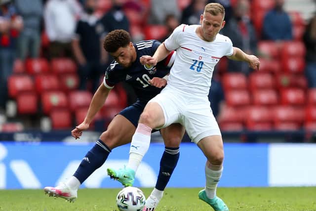 Che Adams (left) was a surprise omission from the starting line-up against the Czechs and the Southampton striker is a strong contender to face England at Wembley. (Photo by ROBERT PERRY/POOL/AFP via Getty Images)
