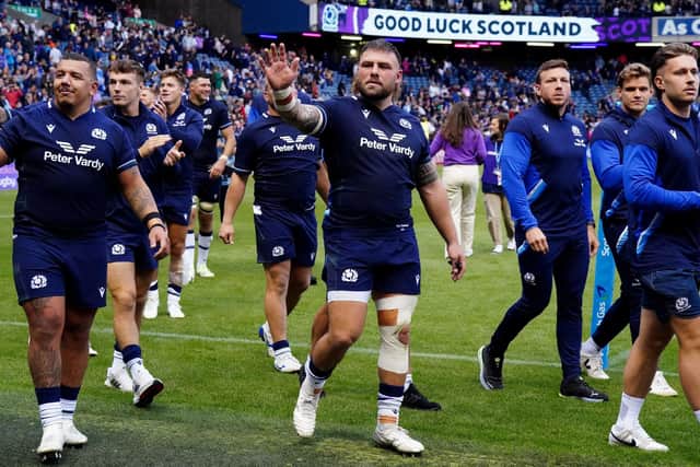 Rory Sutherland, centre, waves to supporters at Murrayfield after Scotland's win over Georgia in their final match before leaving for the Rugby World Cup in France.  (Picture:  Jane Barlow/PA Wire)