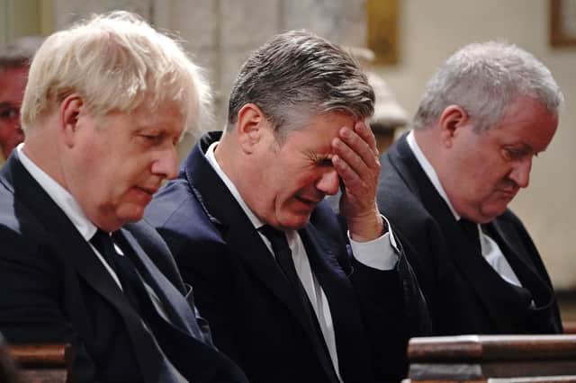 Boris Johnson, Labour leader Sir Keir Starmer and SNP Wesminster leader Ian Blackford attend a service to honour the late Sir David Amess at St Margaret's church in London, England (Picture: Jonathan Brady/WPA pool/Getty Images)