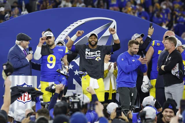 Matthew Stafford #9, Aaron Donald #99 and head coach Sean McVay of the Los Angeles Rams react with the George Halas Trophy after defeating the San Francisco 49ers in the NFC Championship Game at SoFi Stadium on January 30, 2022 in Inglewood, California. (Image credit: Christian Petersen/Getty Images)