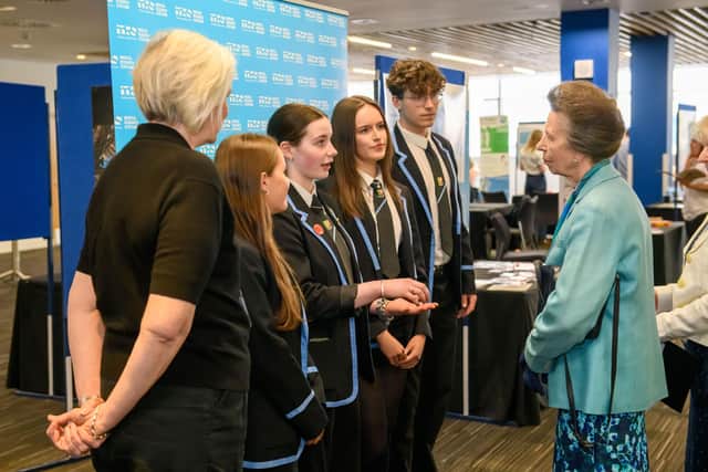 HRH The Princess Royal meeting chemistry teacher Lesley Jackson and her pupils from Dunblane High School