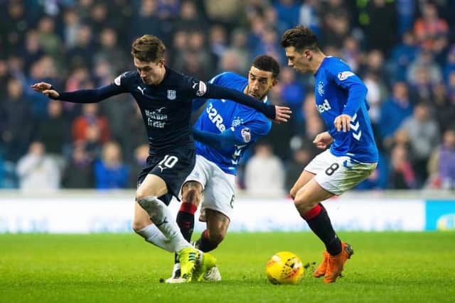 Scott Wright in a challenge with Connor Goldson and Ryan Jack when he played against Rangers at Ibrox during his loan spell at Dundee in 2019. (Photo by Alan Harvey/SNS Group).
