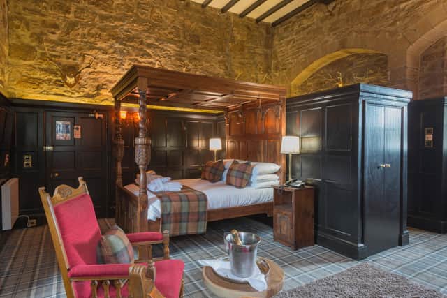 The Old Courtroom with its hand-carved, king sized, Elizabethan-style four poster bed, open fire and 14ft ceilings, is one of the Four Poster Deluxe Rooms.