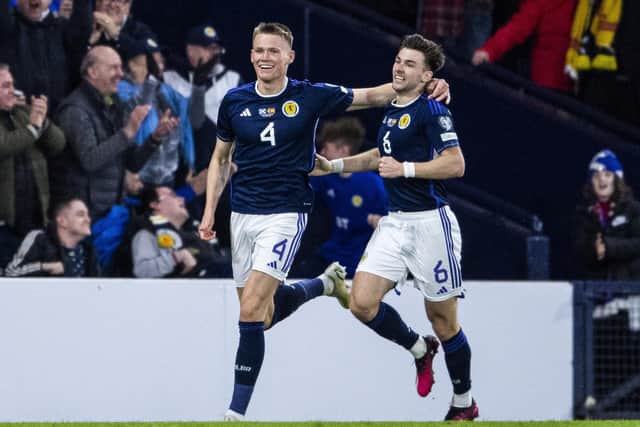 Scotland duo Scott McTominay and Kieran Tierney celebrate the second goal in the 2-0 win over Spain. (Photo by Ross MacDonald / SNS Group)