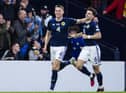 Scotland duo Scott McTominay and Kieran Tierney celebrate the second goal in the 2-0 win over Spain. (Photo by Ross MacDonald / SNS Group)