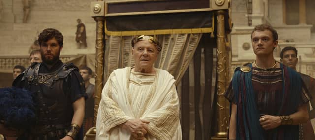Anthony Hopkins as the Emperor in Those About to die with Tom Hughes (left) and Jojo Macari as his sons. Picture: Amazon/Peacock