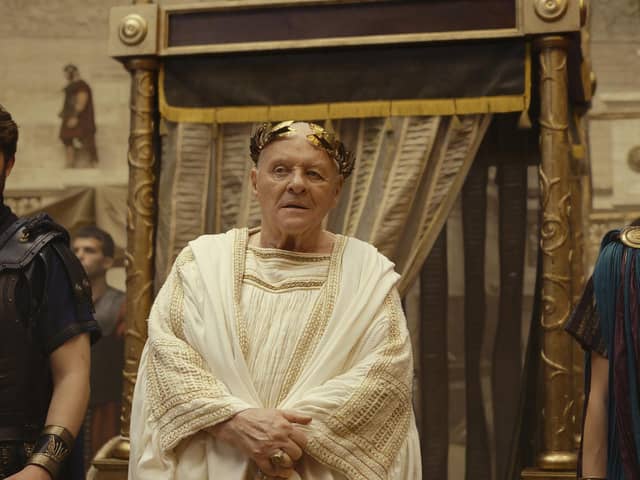 Anthony Hopkins as the Emperor in Those About to die with Tom Hughes (left) and Jojo Macari as his sons. Picture: Amazon/Peacock