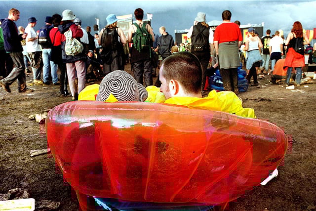 A couple enjoy the atmosphere at T in the Park 2001.
