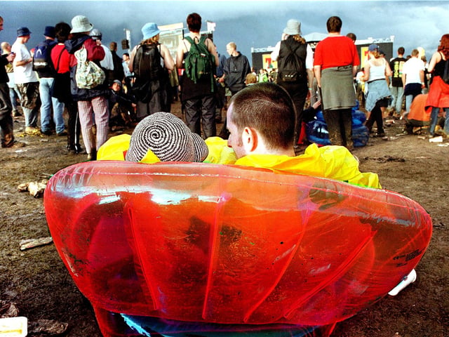 A couple enjoy the atmosphere at T in the Park 2001.