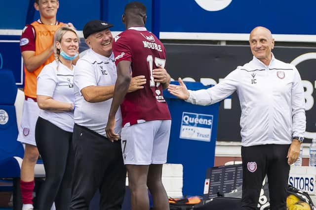 Arbroath manager Dick Campbell hugs Joel Nouble during a match against Queen of the South earlier in the season. (Photo by Roddy Scott / SNS Group)