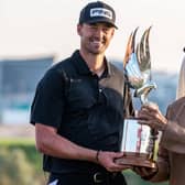 Dundee-based Frenchman Victor Perez receives the trophy from Sheikh Nahyan bin Zayed Al Nahyan, chairman of Abu Dhabi Sports Council, after winning the Abu Dhabi HSBC Championship at Yas Links. Picture: Picture: Ryan Lim/AFP via Getty Images.
