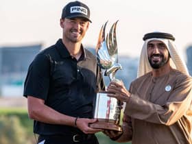 Dundee-based Frenchman Victor Perez receives the trophy from Sheikh Nahyan bin Zayed Al Nahyan, chairman of Abu Dhabi Sports Council, after winning the Abu Dhabi HSBC Championship at Yas Links. Picture: Picture: Ryan Lim/AFP via Getty Images.