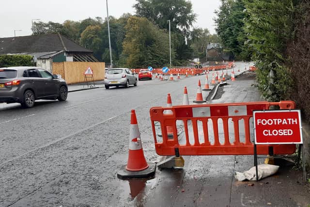 The pavement closure at Canniesburn Toll forces pedestrians to make a lengthy detour round the roundabout. (Photo by The Scotsman)