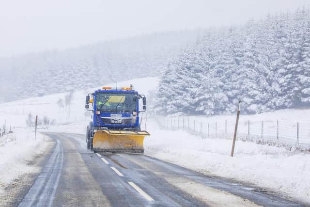 Snow plough clears the A822 near Milton, Perthshire. Stock image.