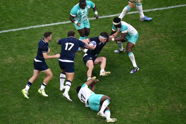 Scotland flanker Rory Darge, centre, in the thick of the action during the Rugby World Cup Pool B match against South Africa at Stade de Marseille.  (Photo by CHRISTOPHE SIMON/AFP via Getty Images)