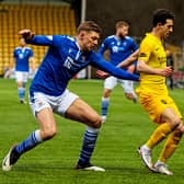 St Johnstone defender Liam Gordon battles with Jason Holt for possession in the recent victory for Callum Davidson's men over Livingston. Picture: SNS