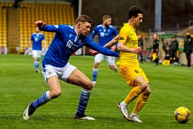 St Johnstone defender Liam Gordon battles with Jason Holt for possession in the recent victory for Callum Davidson's men over Livingston. Picture: SNS