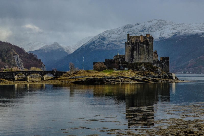 Eilean Donan Castle sits on an island where three great lochs converge making for one of the most postcard-worthy locations in Scotland - it is so picturesque that it inspired the setting for Disney's movie "Brave" as the creators were inspired by its beauty.
