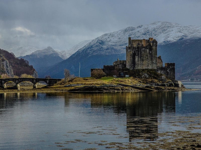 Eilean Donan Castle sits on an island where three great lochs converge making for one of the most postcard-worthy locations in Scotland - it is so picturesque that it inspired the setting for Disney's movie "Brave" as the creators were inspired by its beauty.