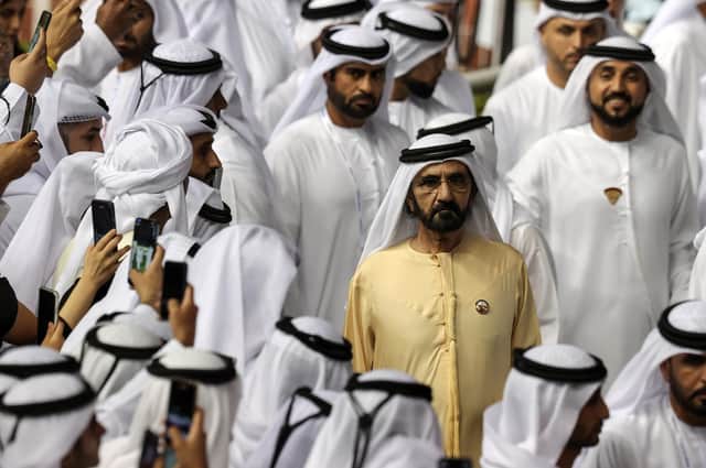 The ruler of Dubai, Sheikh Mohammed bin Rashid al-Maktoum, centre, watches the Dubai World Cup at the Meydan Racecourse in March this year (Picture: Mahmoud Khaled/Getty Images)