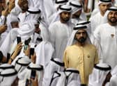 The ruler of Dubai, Sheikh Mohammed bin Rashid al-Maktoum, centre, watches the Dubai World Cup at the Meydan Racecourse in March this year (Picture: Mahmoud Khaled/Getty Images)