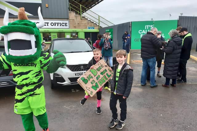 Two young Forest Green fans welcome Ferguson to the club.