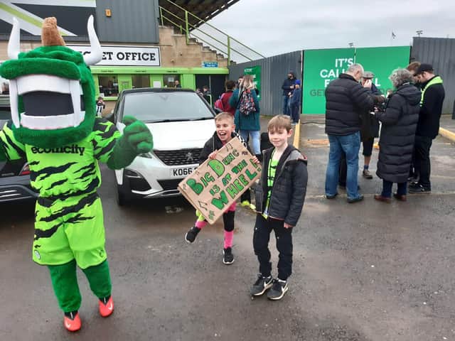 Two young Forest Green fans welcome Ferguson to the club.