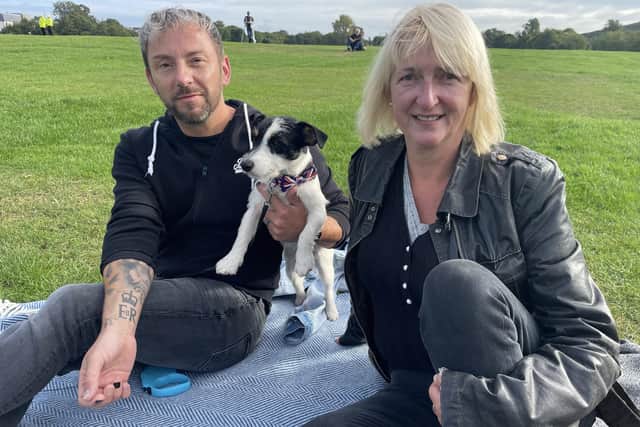 Tracy McDougall and Trevor Thompson, who has the Queen’s ER insignia tattooed on his wrist, came from the Duddingston area of Edinburgh to watch the Queen's funeral on the big screen in Holyrood park