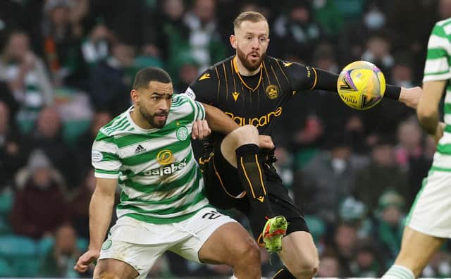 Celtic's Cameron Carter-Vickers (left) tussles with Motherwell's Kevin van veen during a Cinch premiership match between Celtic and Motherwell at Celtic Park.