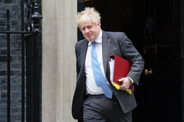 Prime Minister Boris Johnson said MPs should wear the sanctions as a "badge of honour".