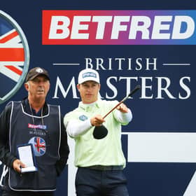 Calum Hill picks a line with caddie Phil "Wobbly" Morbey on the 17th hole during the first round of The Betfred British Masters hosted by Danny Willett at The Belfry. Picture: Andrew Redington/Getty Images.