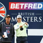 Calum Hill picks a line with caddie Phil "Wobbly" Morbey on the 17th hole during the first round of The Betfred British Masters hosted by Danny Willett at The Belfry. Picture: Andrew Redington/Getty Images.
