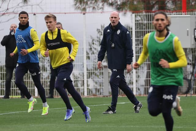 Philippe Clement on the training pitch with his Monaco players. (Photo by VALERY HACHE/AFP via Getty Images)