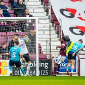 Jason Cummings glances a header home to level the scores for Dundee.