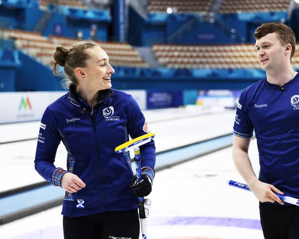 Jen Dodds and Bruce Mouat are all smiles after qualifying for World Mixed Doubles Curling Championship knock-out stages.