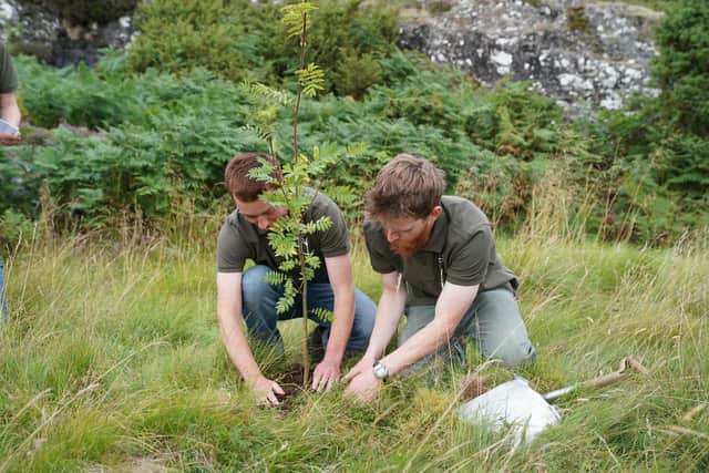 Trees for Life trainees Angus Crawley and Grymmsy Robinson (right) plant a Rowan tree during the official breaking of ground to mark the beginning of the construction of the world’s first rewilding centre at Trees for Life’s 10,000-acre Dundreggan estate near Loch Ness