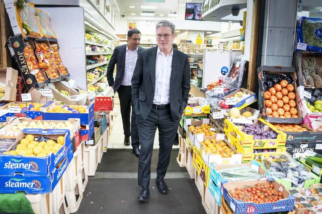 Labour Party leader Sir Keir Starmer (right) and Anas Sarwar, leader of the Scottish Labour Party, during a visit to the Stalks & Stem store, a small business in Shawlands, Glasgow.
