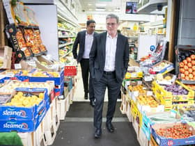 Labour Party leader Sir Keir Starmer (right) and Anas Sarwar, leader of the Scottish Labour Party, during a visit to the Stalks & Stem store, a small business in Shawlands, Glasgow.