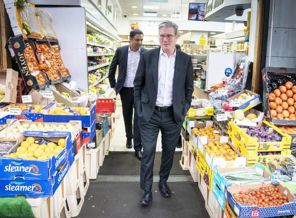 Labour Party leader Sir Keir Starmer (right) and Anas Sarwar, leader of the Scottish Labour Party, during a visit to the Stalks & Stem store, a small business in Shawlands, Glasgow.