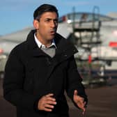 Prime Minister Rishi Sunak stands in front of Typhoon fighter jets as he speaks during a television interview during his visit to Royal Air Force RAF Coningsby, near Lincoln. Picture: Joe Giddens/POOL/AFP via Getty Images