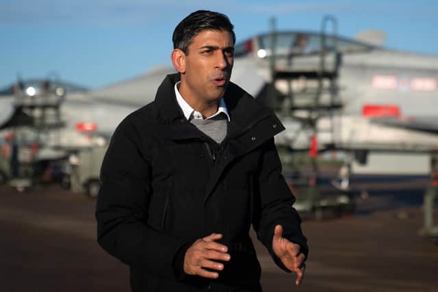 Prime Minister Rishi Sunak stands in front of Typhoon fighter jets as he speaks during a television interview during his visit to Royal Air Force RAF Coningsby, near Lincoln. Picture: Joe Giddens/POOL/AFP via Getty Images